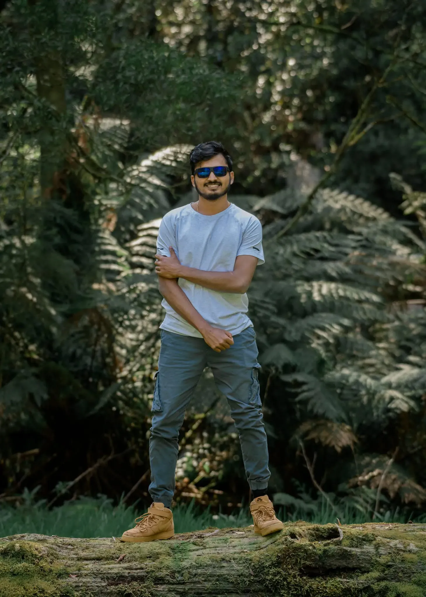 Toshan Wijeratne standing among tree ferns